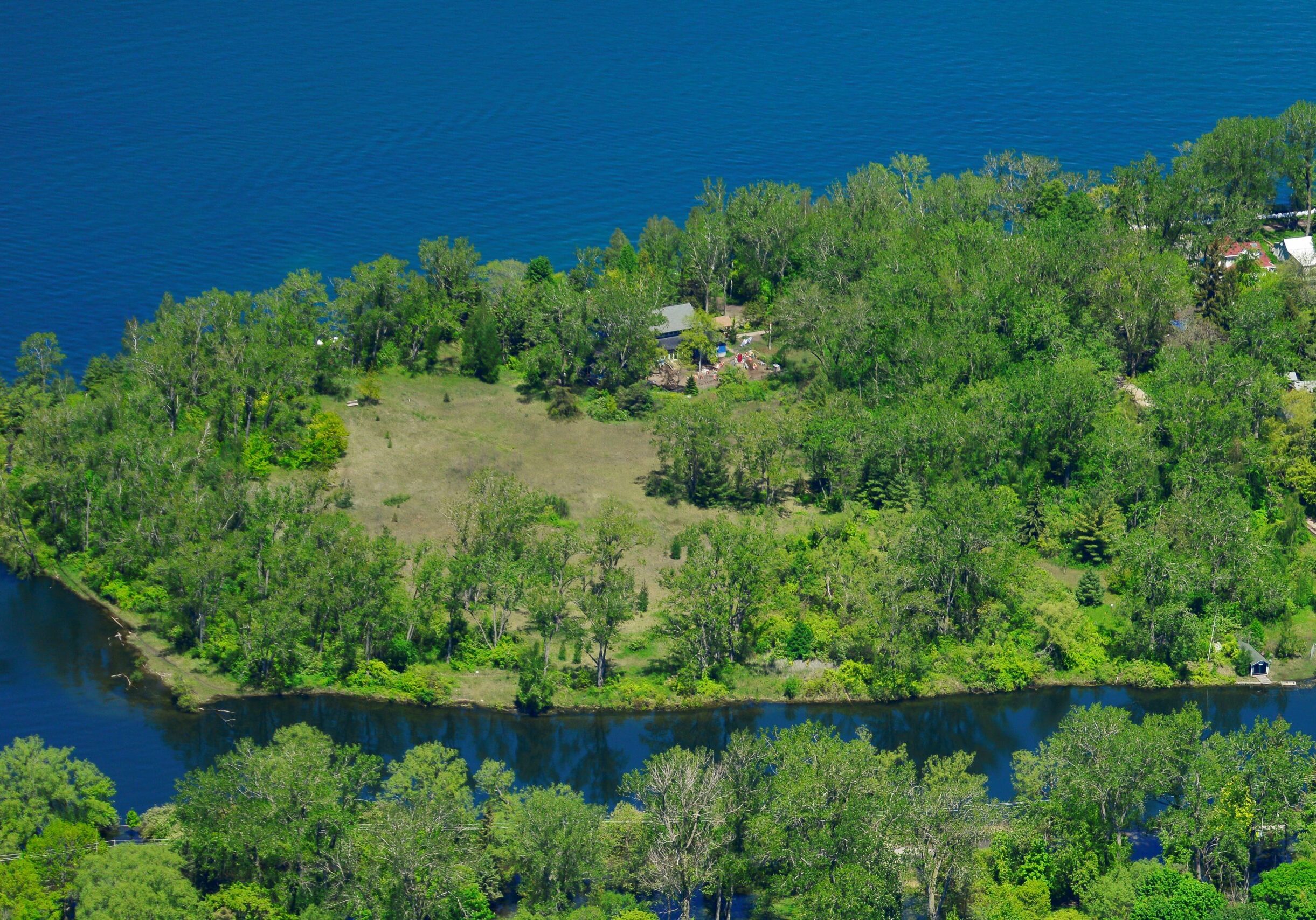 Aerial view of south end of Algonquin Island with wooded and open lawn areas and the Montessori School.